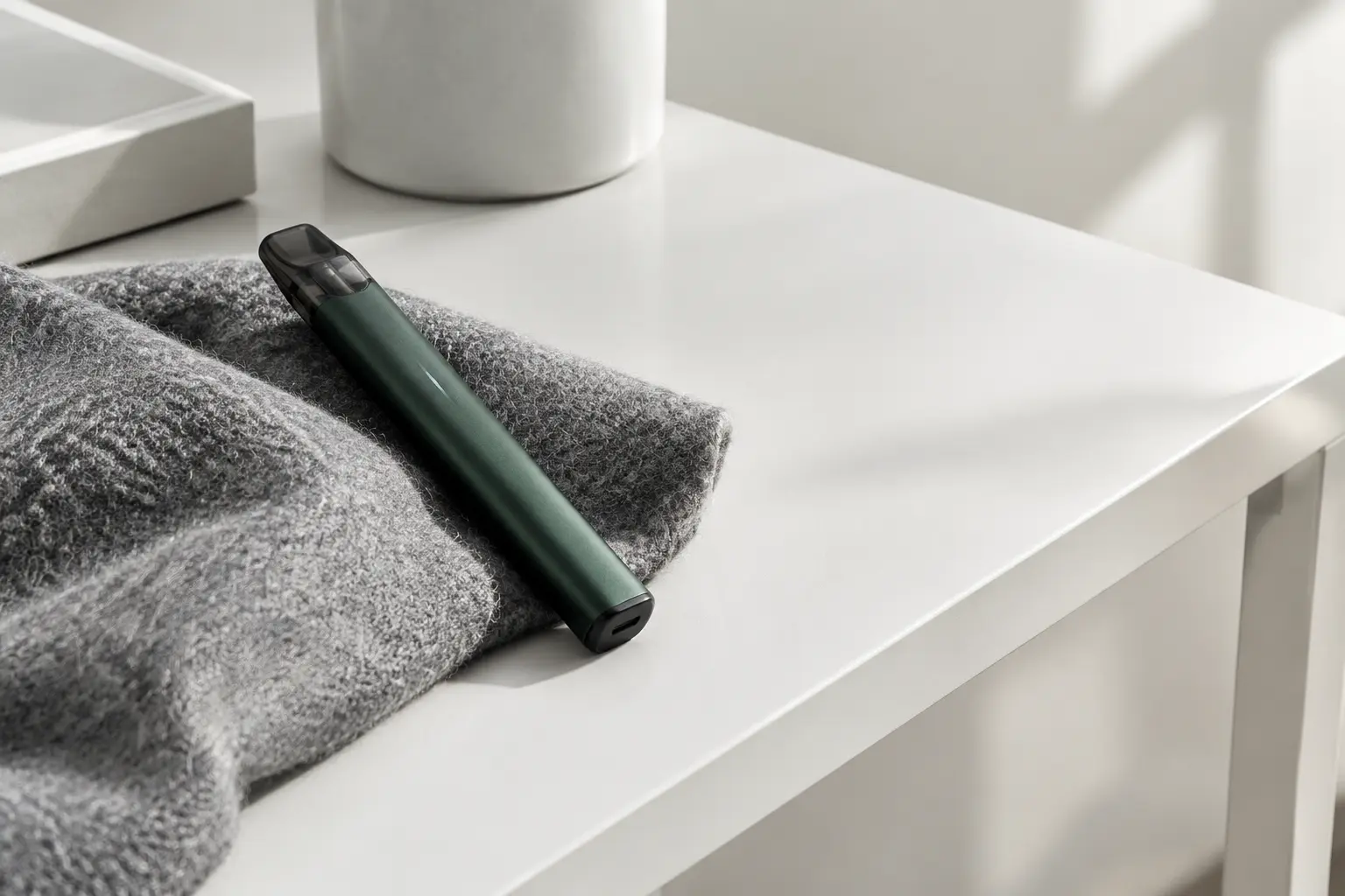 A precision pod device arranged on a white studio desk